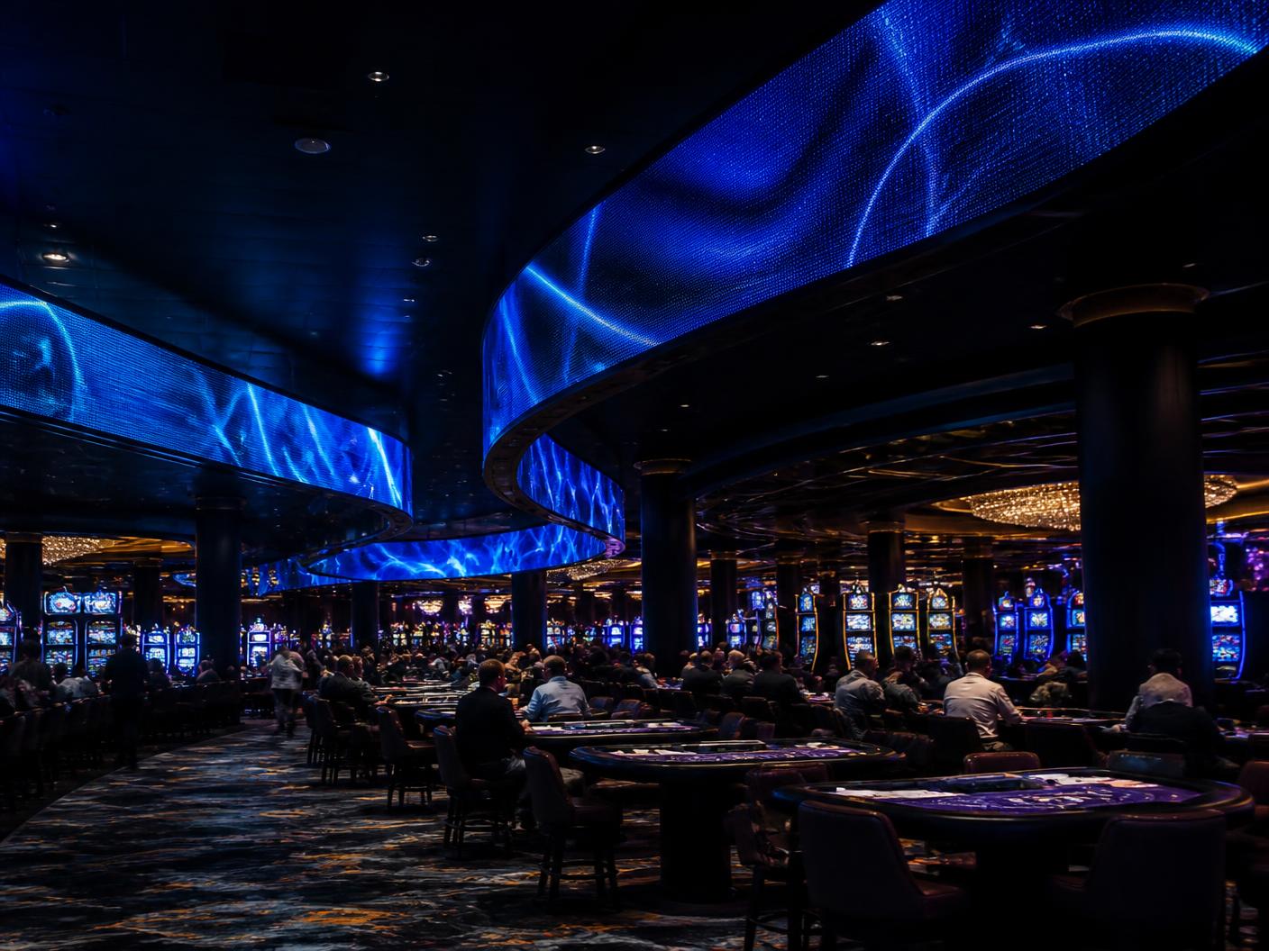 Curved digital signage ribbon above a casino gaming pit